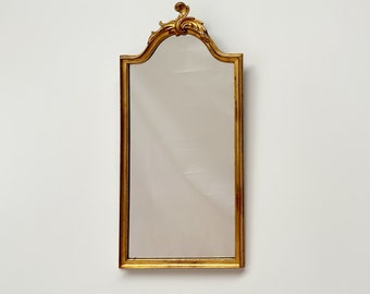 Miroir vintage avec cadre doré et ornements