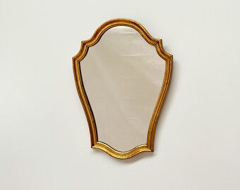 Miroir doré avec cadre vintage