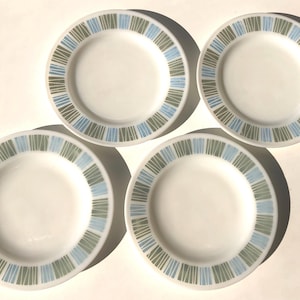 May include: A set of three ceramic nesting bowls in shades of blue, green, and white. The bowls have a speckled glaze and a simple, modern design. The largest bowl is about 15 cm in diameter.