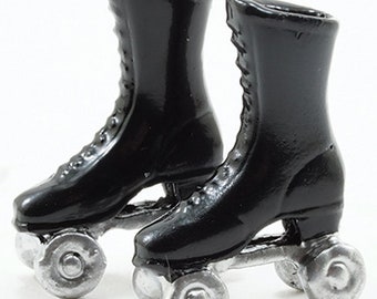 May include: A pair of black roller skates with silver wheels. The skates have laces and are made of a shiny material.