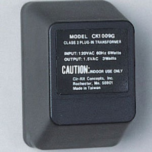 May include: Black electrical transformer with a white label that reads "MODEL CK1009G CLASS 2 PLUG-IN TRANSFORMER INPUT: 120VAC 60Hz 6Watts OUTPUT: 1.5VAC Watts CAUTION: INDOOR USE ONLY Cir-Kill Concepts, Inc. Rochester, Ms. 56901 Made in Taiwan"