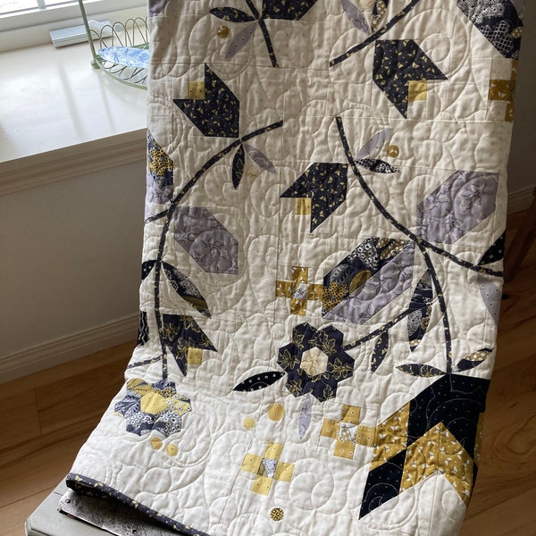 A lovely Flower Garden quilt to adorn your home. Traditional floral applique' design in modern black, mustard yellow, and gray on ivory.