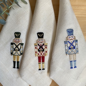 Nutcracker Linen Napkins - Exquisite Embroidered Christmas Table Decor - Perfect Hostess or Holiday Party Gift