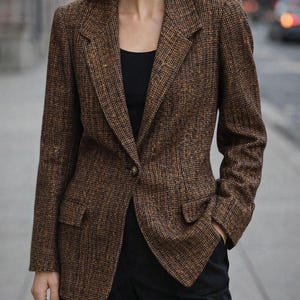 May include: A white ceramic mug with a black handle and the text "But First, Coffee" in a handwritten style. The mug is on a white surface. The mug is 4 inches tall.