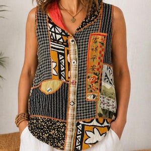 May include: Sleeveless patchwork top with a mix of patterns, including houndstooth, floral, and geometric designs. The top features a button-down front, a red collar, and a pocket. The top is paired with white trousers.