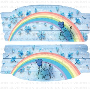 May include: A blue and white wooden background with a rainbow and a teddy bear holding two blue balloons. The teddy bear is in the center of the image. The rainbow is above the teddy bear. The background is decorated with blue flowers and white petals.