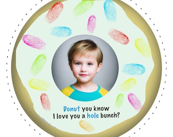 May include: A donut-shaped card with a photo of a child in the center. The donut is decorated with colorful fingerprints and the text "Donut you know I love you a hole bunch?"