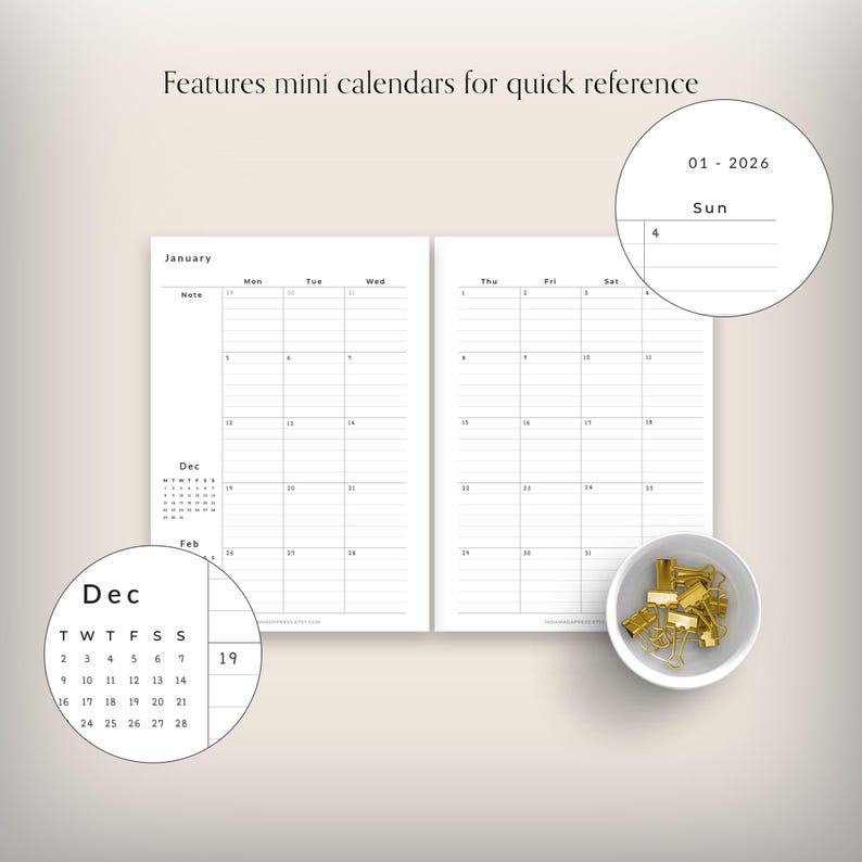 May include: A minimalist planner with a white interior, featuring monthly calendar pages and mini calendars for quick reference. The image includes a small bowl of gold binder clips. Text on the image reads "Features mini calendars for quick reference."