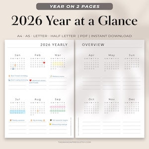 May include: A printable 2026 year-at-a-glance calendar in a minimalist design. The calendar is divided into two pages, with the year's months displayed in a grid format. The text "2026 Year at a Glance" is at the top.