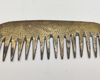 A rare ancient Roman comb or bronze hair item.