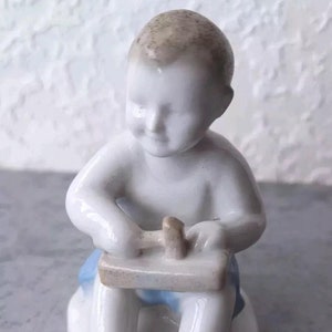 Rare porcelain figurine of the USSR &quot;Boy with a hammer&quot; 9.5 cm.