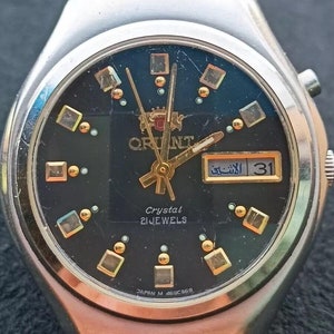 Raro reloj automático original japonés Orient con correa.