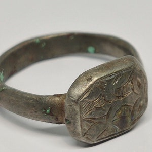 Ancient Roman bronze ring with an ornament.