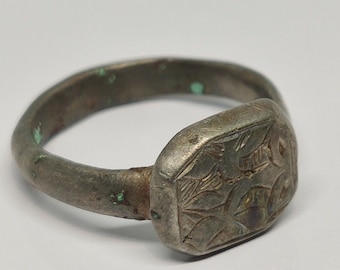 Ancient Roman bronze ring with an ornament.