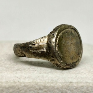 Ancient Roman bronze ring with an ornament.