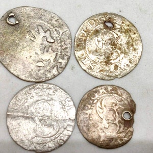 Silver medieval coins, Prague grosz and Riga solidus.