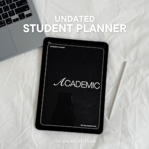 May include: A black digital tablet displaying an academic planner with the text ACADEMIC and THE BALANCED PLAN, positioned next to a silver laptop and a white stylus. The screen also shows the text ACADEMIC PLANNER at the top left corner.