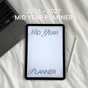 May include: A digital tablet displaying the text 2026 - 2027 MID YEAR PLANNER with the words MID YEAR and PLANNER in a blue script font. A white stylus rests beside the tablet, which is positioned next to a dark grey laptop computer.