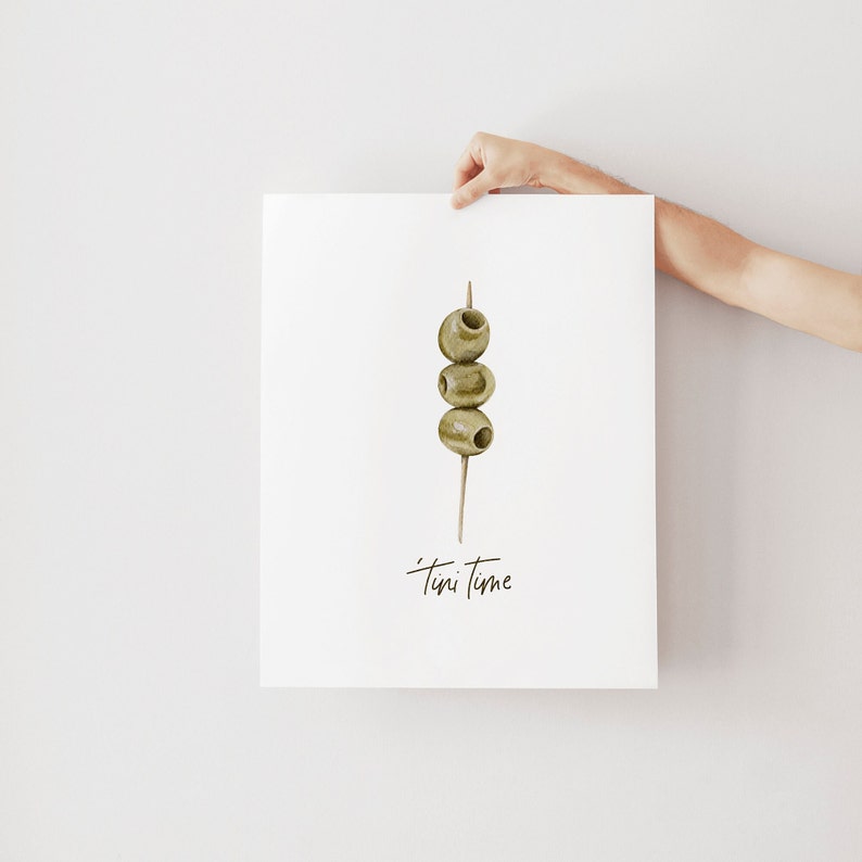 Art print with hand painted water color olives on a toothpick with the saying "tini time" in handwritten font