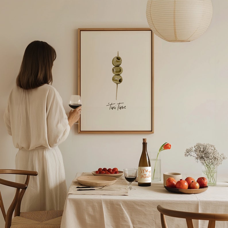 Art print with hand painted water color olives on a toothpick with the saying "tini time" in handwritten font