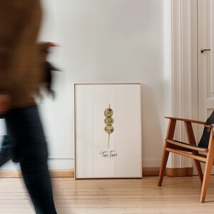Art print with hand painted water color olives on a toothpick with the saying "tini time" in handwritten font