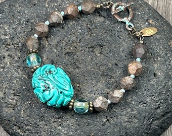 Unique carved turquoise colored howlite bracelet, with bronzite matte faceted beads and turquoise Czech glass,  toggle clasp