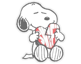 May include: A white cartoon character, Snoopy, is holding a red and white heart with the letters "SF" on it. The image has a distressed, vintage look. The character is sitting down with its eyes closed.