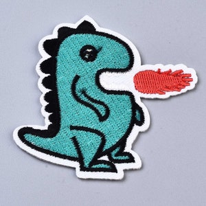 May include: An embroidered iron-on patch featuring a teal dinosaur with black outlines and a black spiked back. The dinosaur is depicted in profile, facing right, with a bright red flame-like shape emerging from its mouth, outlined in white.