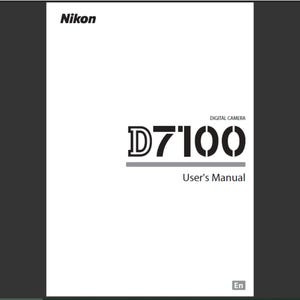 May include: A white Nikon D7100 digital camera user's manual. The cover features the Nikon logo at the top, with the model name D7100 in a bold, stylized font. The words "User's Manual" are below the model name.