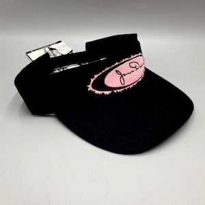 May include: Black visor with a pink oval logo that says "Jane Doe" in a cursive font.