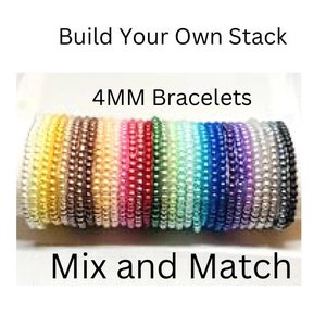May include: A collection of colorful 4MM bracelets in various shades, including yellow, brown, pink, red, green, blue, purple, and silver. The image includes the text "Build Your Own Stack" and "Mix and Match".