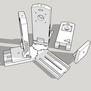 May include: A collection of white, geometric, 3D-printed components, including rectangular and triangular shapes. The pieces are arranged in a scattered, exploded view, suggesting an assembly process or a breakdown of a larger structure.