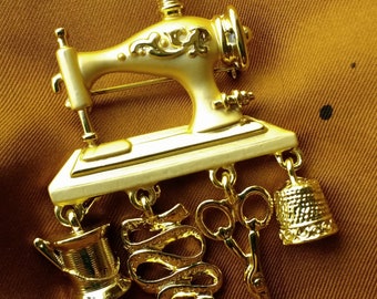 Danecraft Sewing Themed Charm Pin: Sewing Machine with Dangling Tape Measure, Scissors, Thread, & Thimble on Vintage 1980's Goldtone Brooch