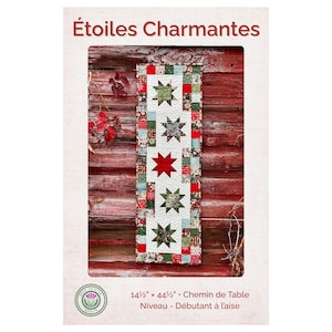 May include: A rectangular table runner pattern titled Étoiles Charmantes featuring five star motifs in green, red, and patterned fabrics on a white background, bordered by a patchwork frame. The dimensions are 14.5 inches by 44.5 inches.