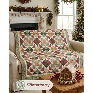 May include: A rectangular quilt featuring a geometric patchwork pattern in shades of forest green, deep red, and tan. The design consists of repeating square and triangular blocks with a decorative border, draped over a neutral-colored sofa.