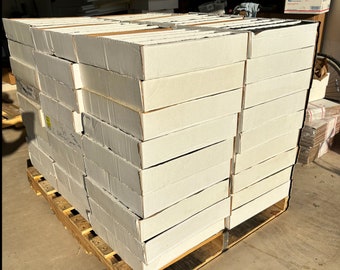 May include: A pallet stacked with 1000 white boxes, labeled "1000 CARDS 25 RARES & 25 FOILS".