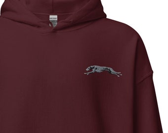 May include: A maroon hooded sweatshirt with a small grey embroidered image of a running greyhound on the left chest.