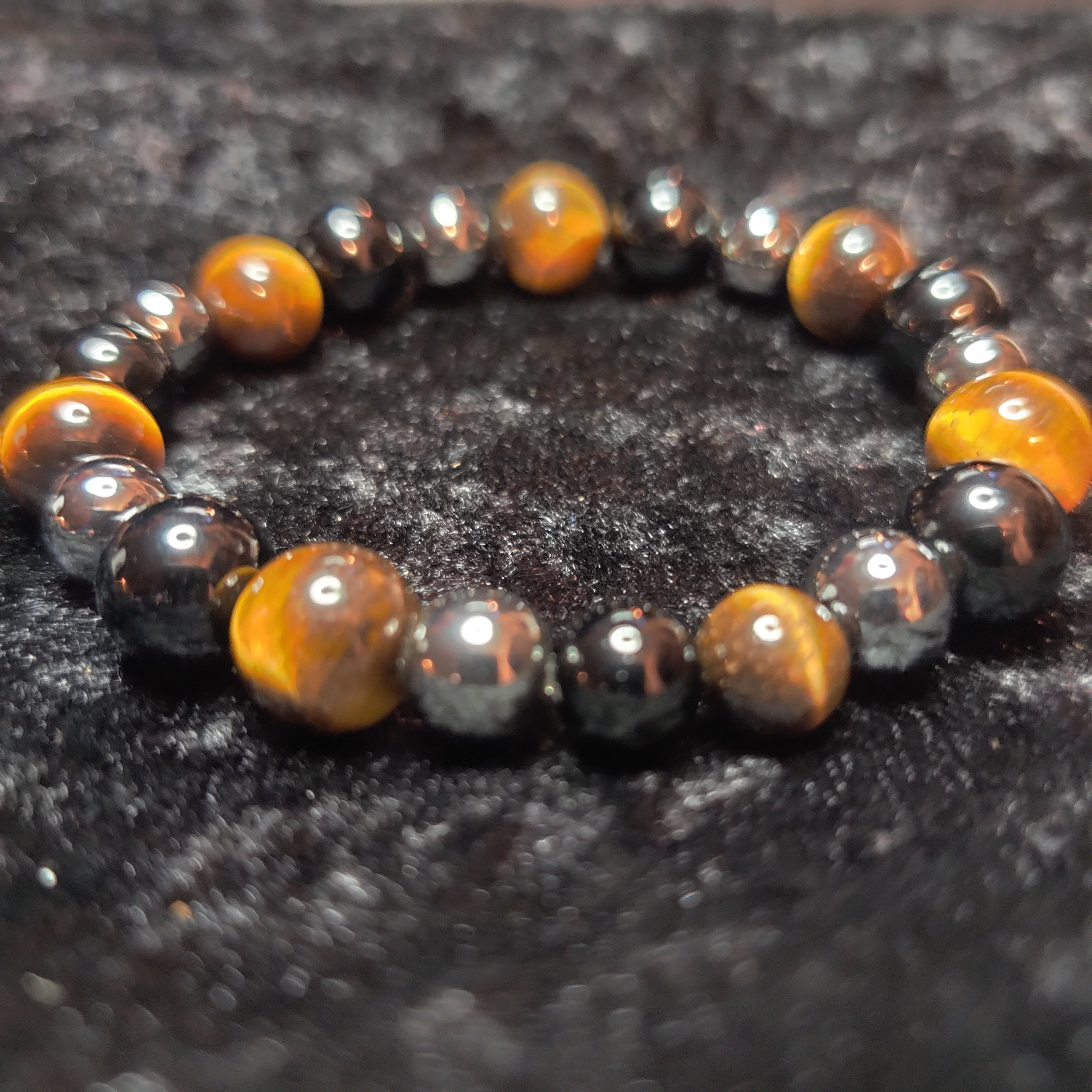 Triple vortex of protection, Tigers Eye and Obsidian, and Hematite. Balancing Yin and Yang while releasing darkness before Transformation.