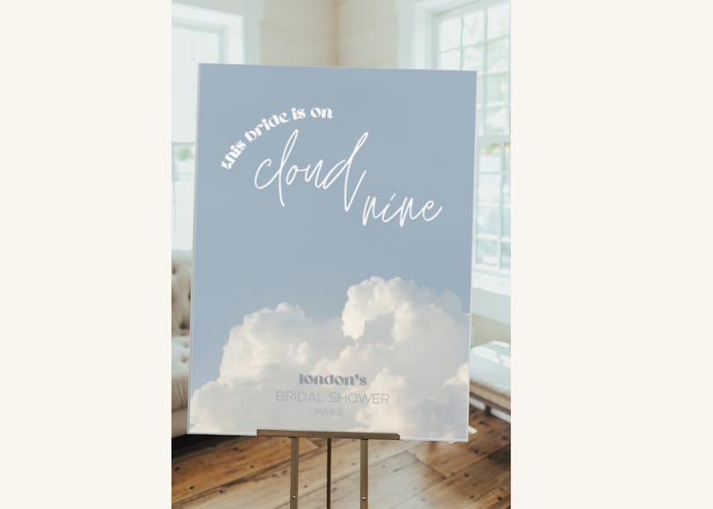 May include: A blue and white bridal shower sign with a cloud design and the text "This bride is on cloud nine" and "London's Bridal Shower May 13".