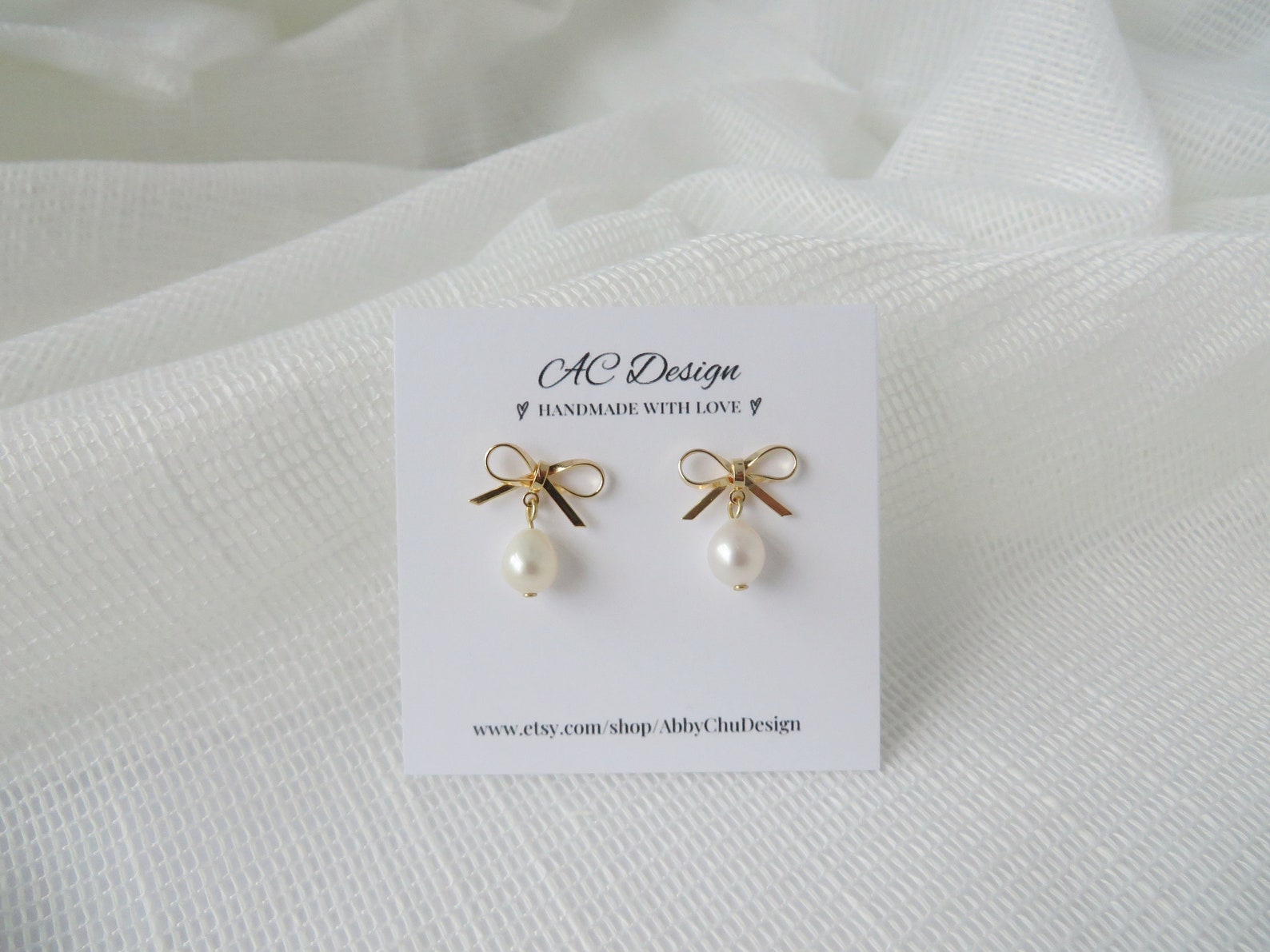 PEARL BEADED BOW EARRING main image 0