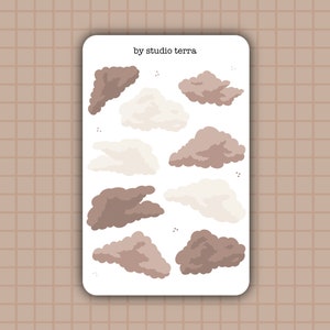 Könnte beinhalten: Eine Bogen mit Aufklebern, die verschiedene Wolkenformen in Braun- und Weißtönen zeigen. Oben auf dem Bogen steht der Text "by studio terra".