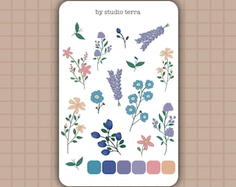 May include: A sheet of floral stickers with a variety of flowers in shades of blue, pink, and yellow. The sticker sheet includes a color palette with blue, purple, pink, and orange swatches. The text "by studio terra" is at the top of the sheet.