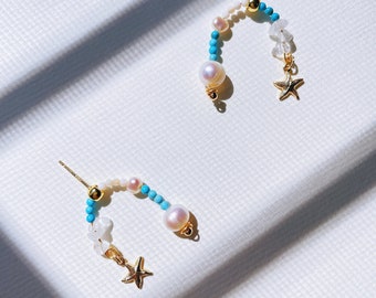 A PAIR OF CUTE LITTLE TIBETAN SILVER DANGLY STARFISH