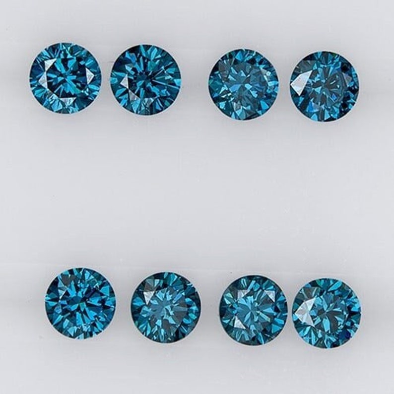 May include: Eight round blue diamonds on a white background.
