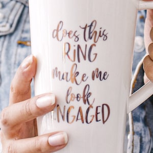 Ceramic mug with rose-gold print Does This Ring Make Me Look Engaged. Perfect engagement gift.