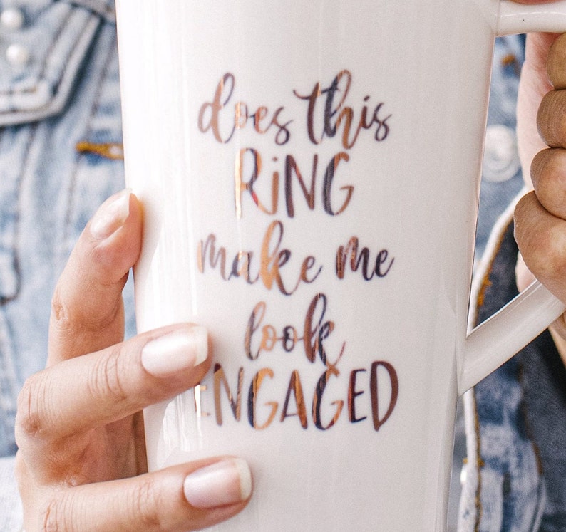 Ceramic mug with rose-gold print Does This Ring Make Me Look Engaged. Perfect engagement gift.