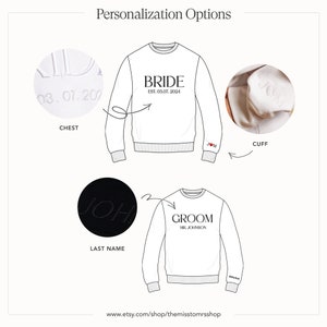 May include: A white sweatshirt with the word "Bride" and the date "EST. 03.07.2024" printed on the front. The sweatshirt also has the word "Groom" and the text "MR. JOHNSON" printed on the front. The sweatshirt has a small heart with the letter "J" printed on the cuff. The sweatshirt has a small heart with the date "03.07.202" printed on the chest. The sweatshirt has the last name "JOH" printed on the back.