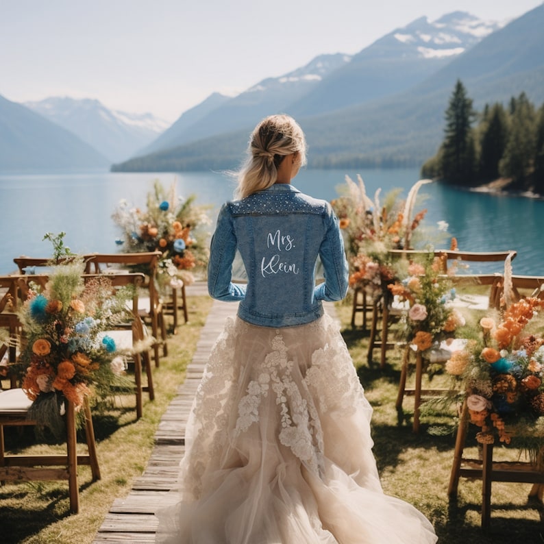 Personalized bridal denim jacket. Made from soft denim and decorated with faux pearls for a chic look. White jean jacket custom embroidered with your name. Perfect to wear for an engagement photoshoot.
