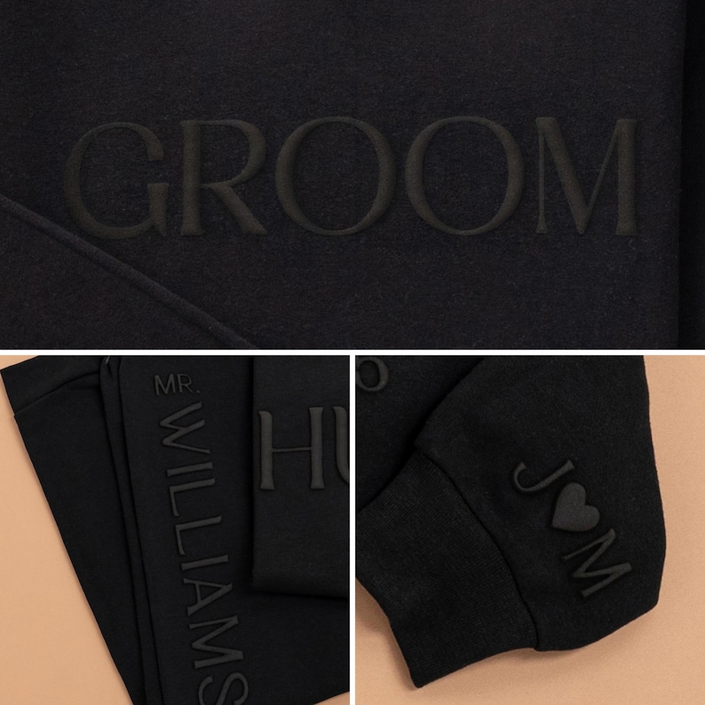 K&ouml;nnte beinhalten: Schwarzer Pullover mit dem Wort "GROOM" auf der Vorderseite gestickt. Der linke &Auml;rmel ist vertikal mit dem Text "MR. WILLIAMS" bestickt. Der rechte &Auml;rmel ist mit einem Herzen mit den Buchstaben "JM" bestickt.
