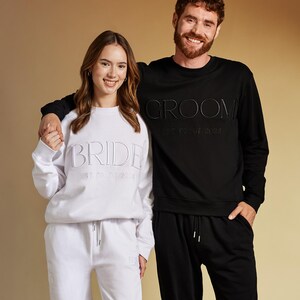 Matching Sweatshirts For Bride and Groom. Can be personalized on the cuff and chest with Premium Embroidery. Engagement Gift For Couple